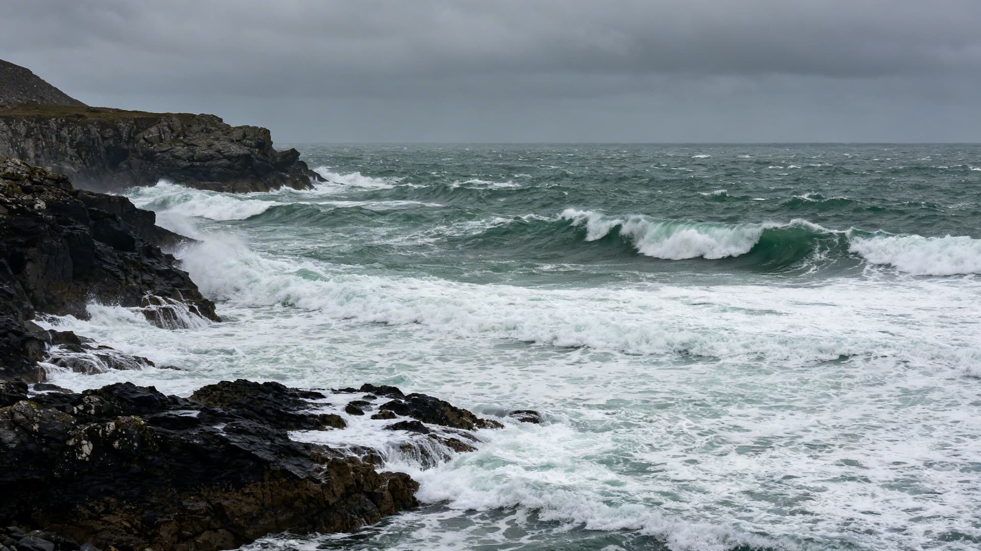 Atlantic swell building along the west coast of Ireland, dramatic rocky coastline illustrating the tidal conditions and open-water environment sea kayakers navigate