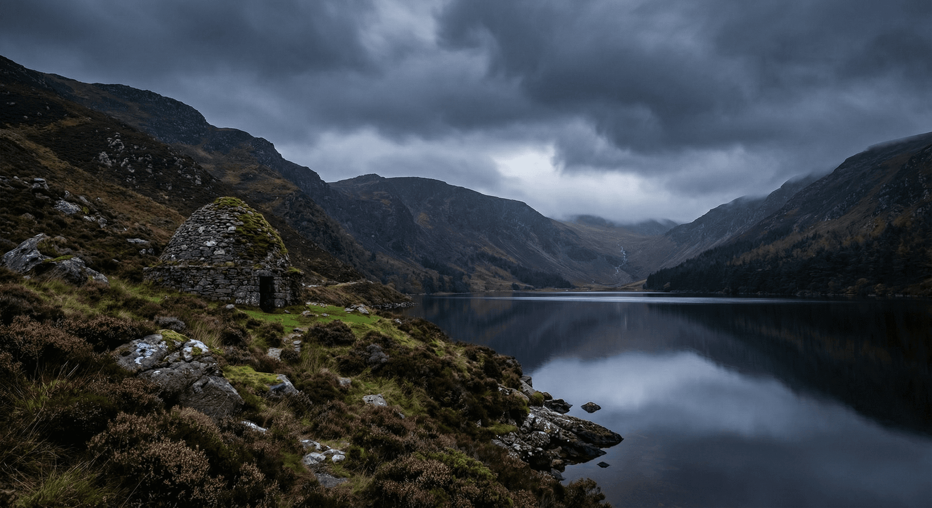 Upper lake at Glendalough with mountain reflection