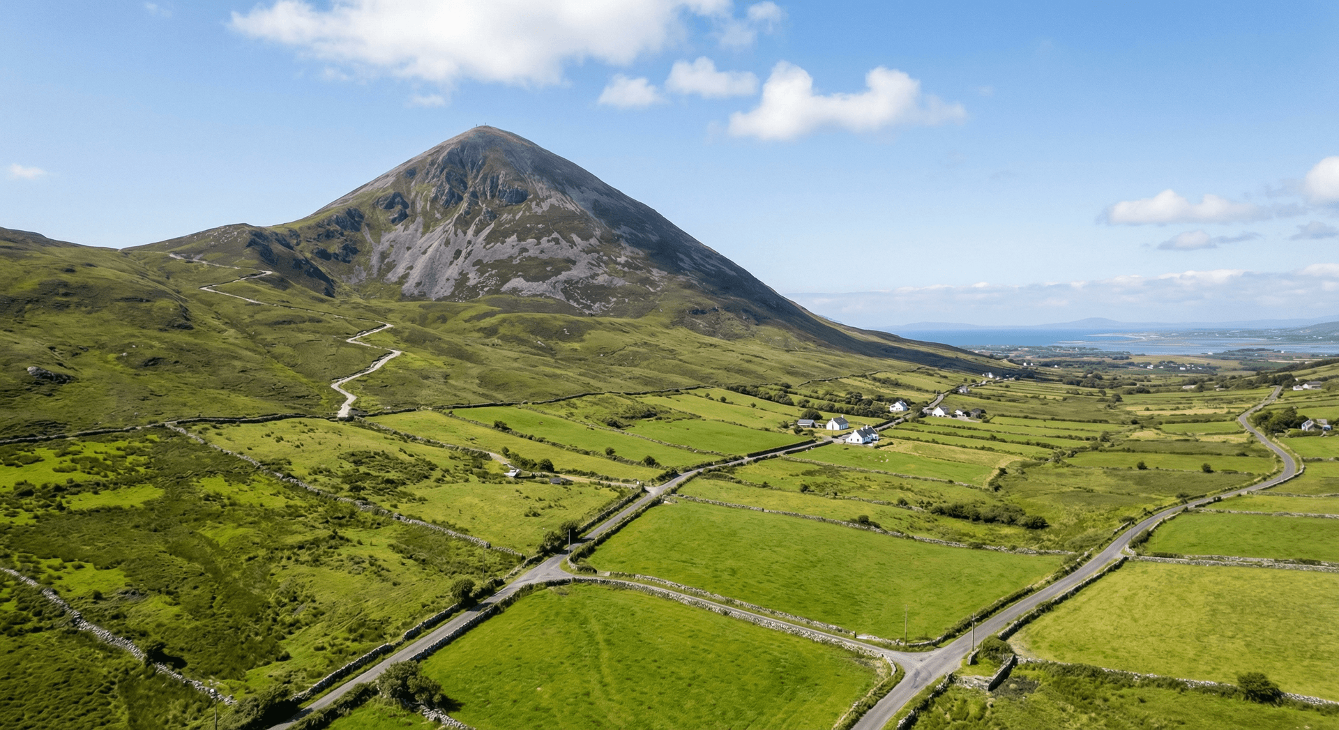 Croagh Patrick mountain rising dramatically from green landscape